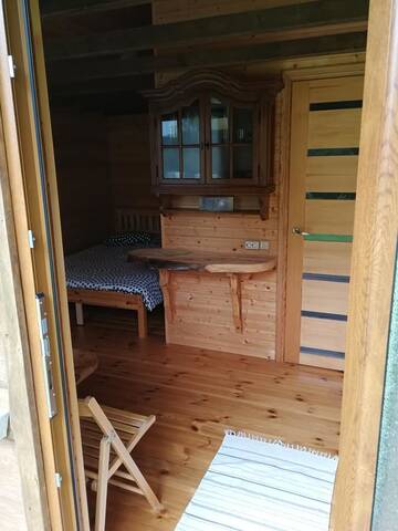 Фото номера Двухместный номер с 1 кроватью и патио Кемпинги Iecupes wooden cabin with view to river г. Иецава 7