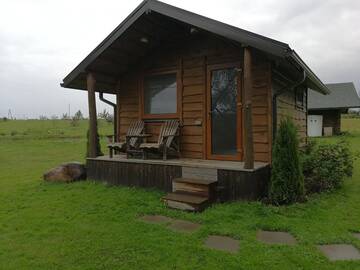 Фото номера Двухместный номер с 1 кроватью и патио Кемпинги Iecupes wooden cabin with view to river г. Иецава 17